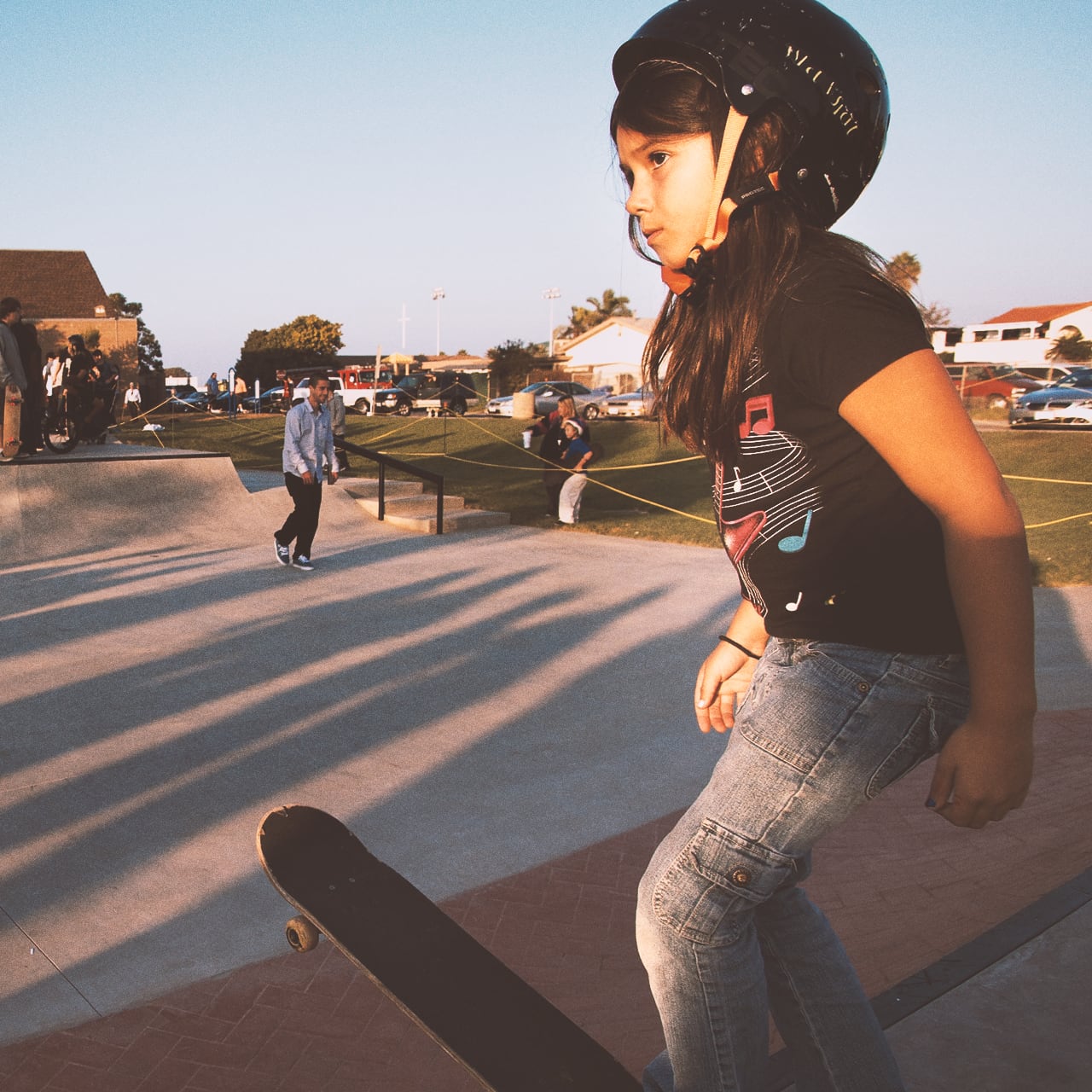 Image of girl ready to skateboard.